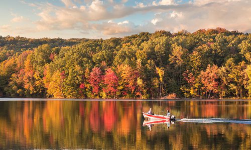 Speed boat on a lake in fall