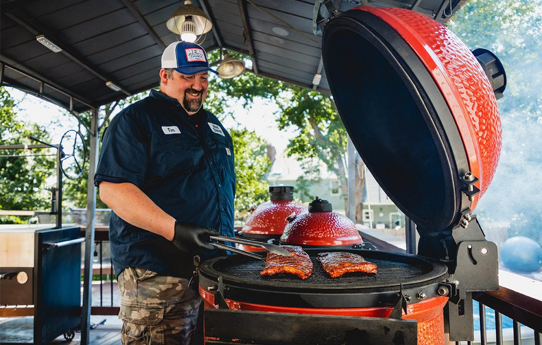 Tim Shelburn cooking on a BBQ.