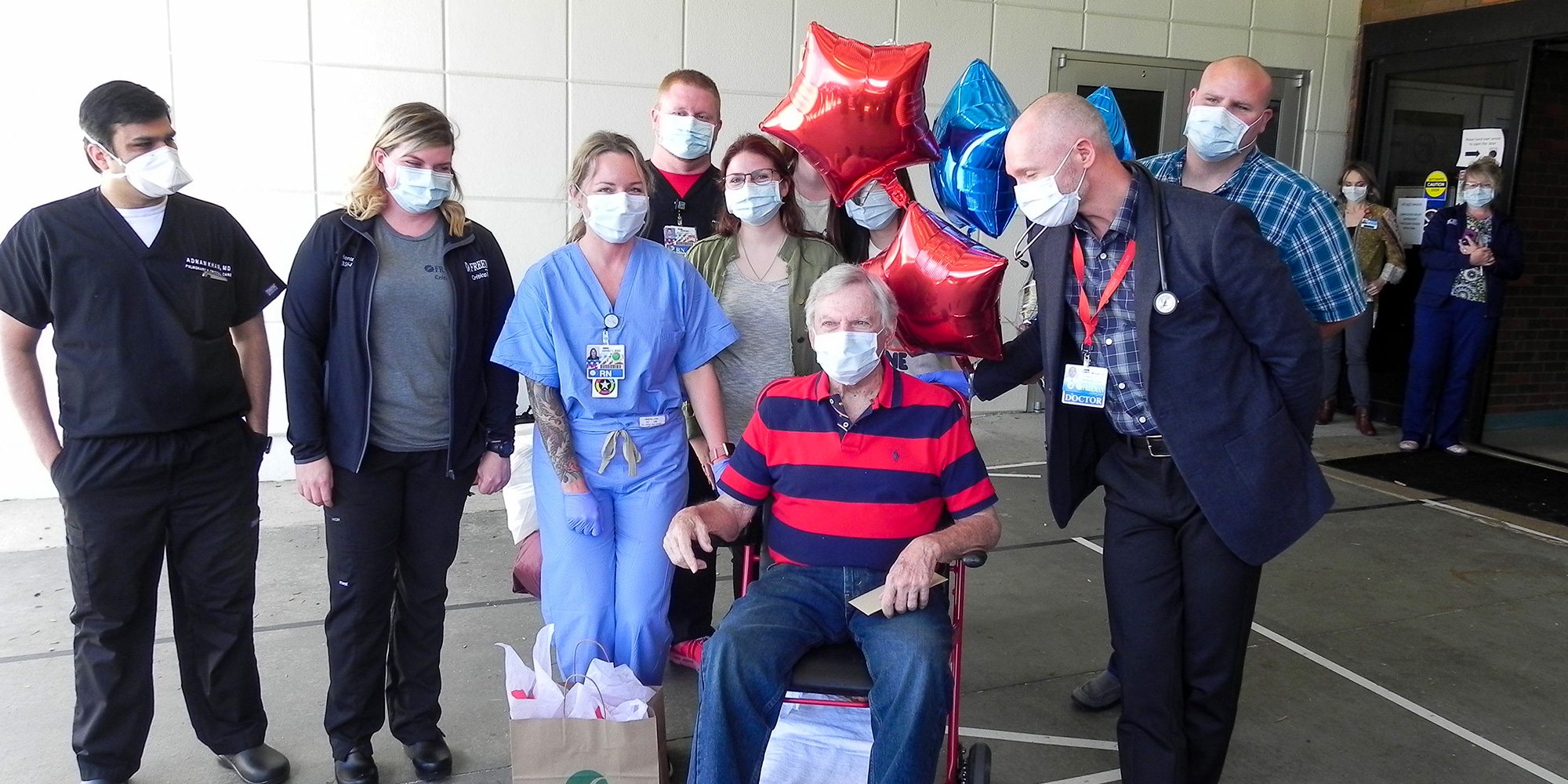 Wallace Lea, Dr. Robert McNab and Freeman Hospital staff members