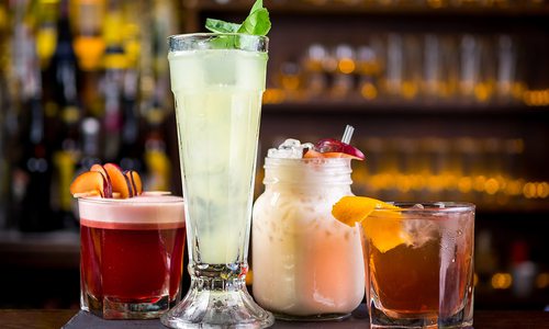 various cocktails and mocktails on a bar