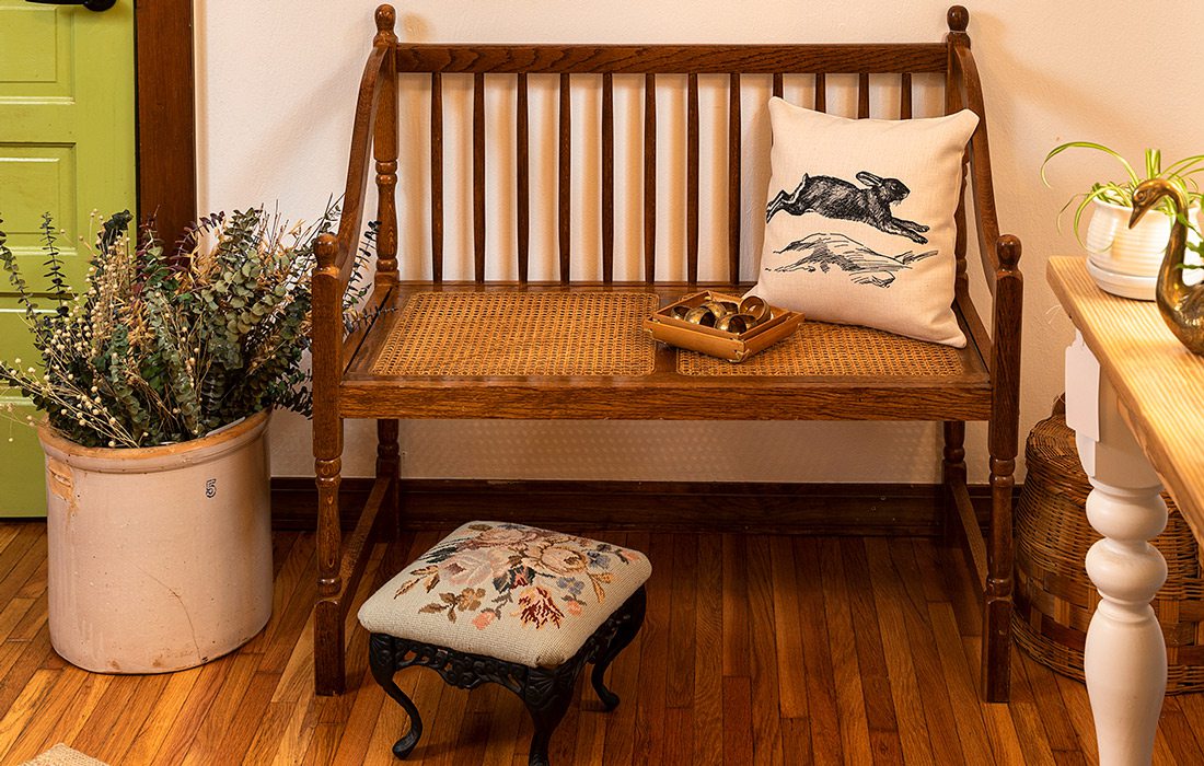 Bench with pillow and plants