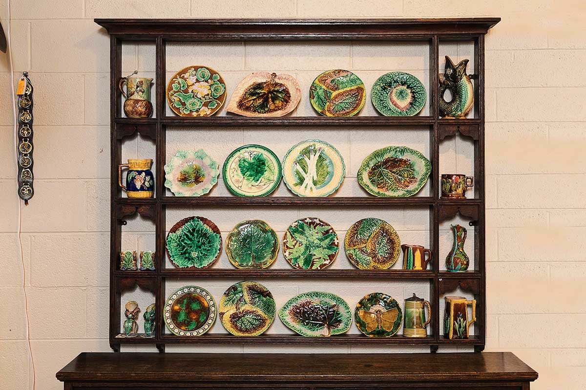 brown wooden chest with rows of green, ornate plates