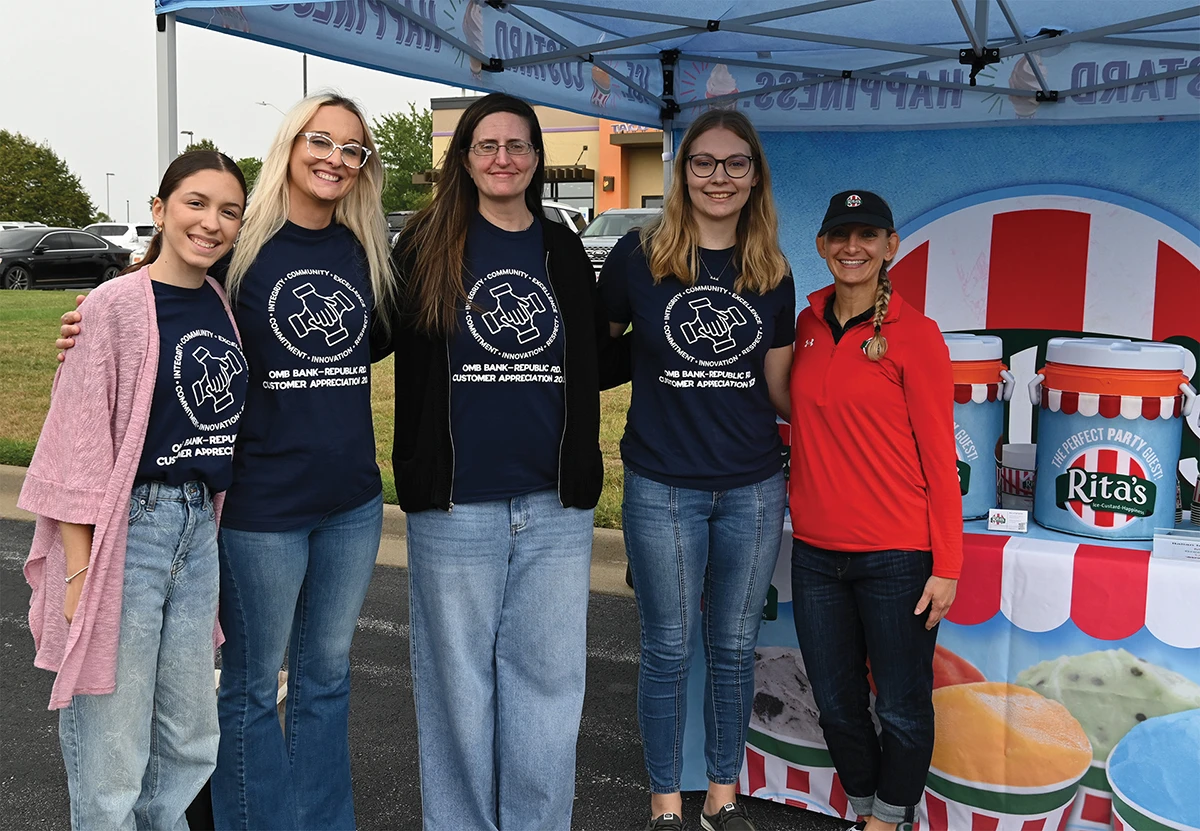 OMB Bank employees at a community event.