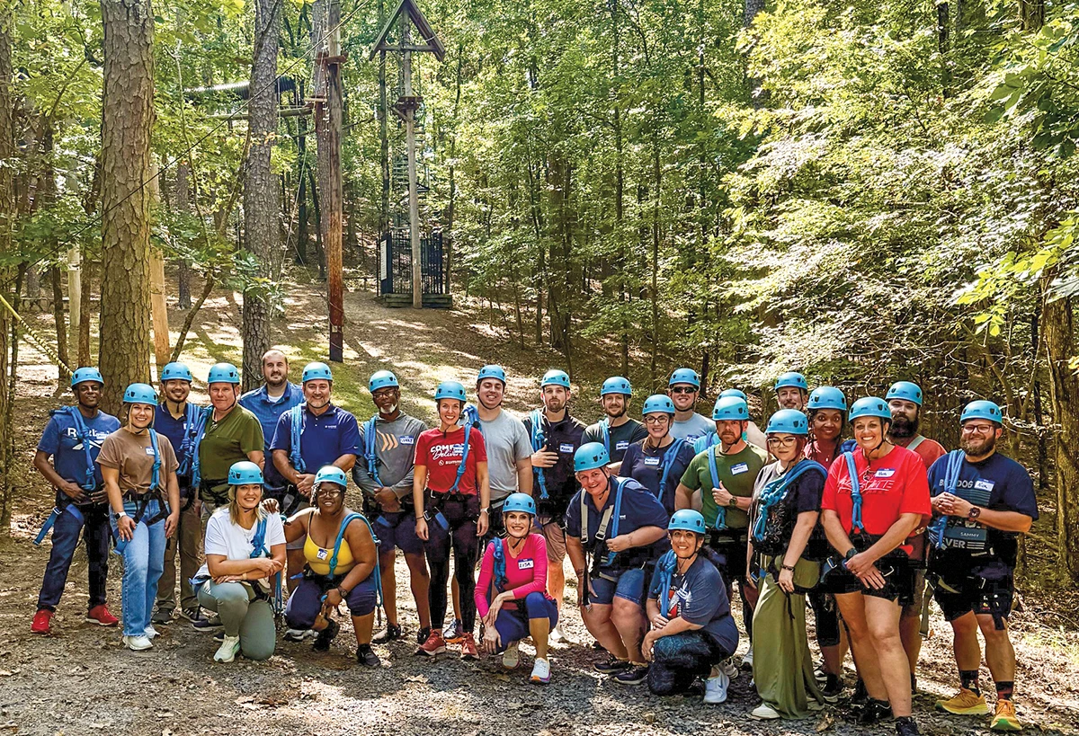 Summit Natural Gas of Missouri employees at a team-building ropes course.