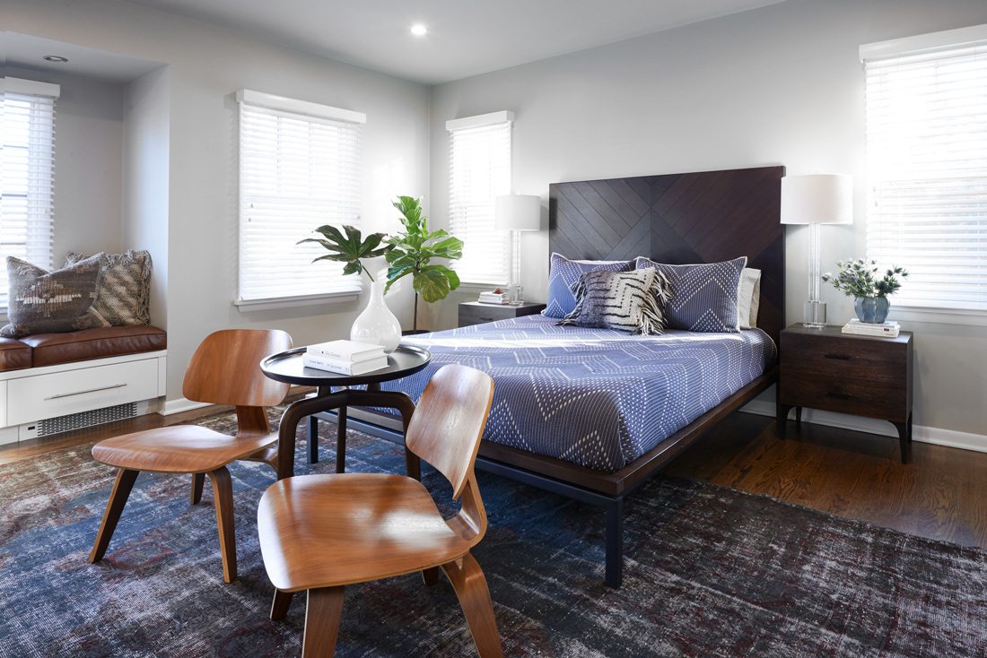 Midcentury bedroom with blue bedspread.