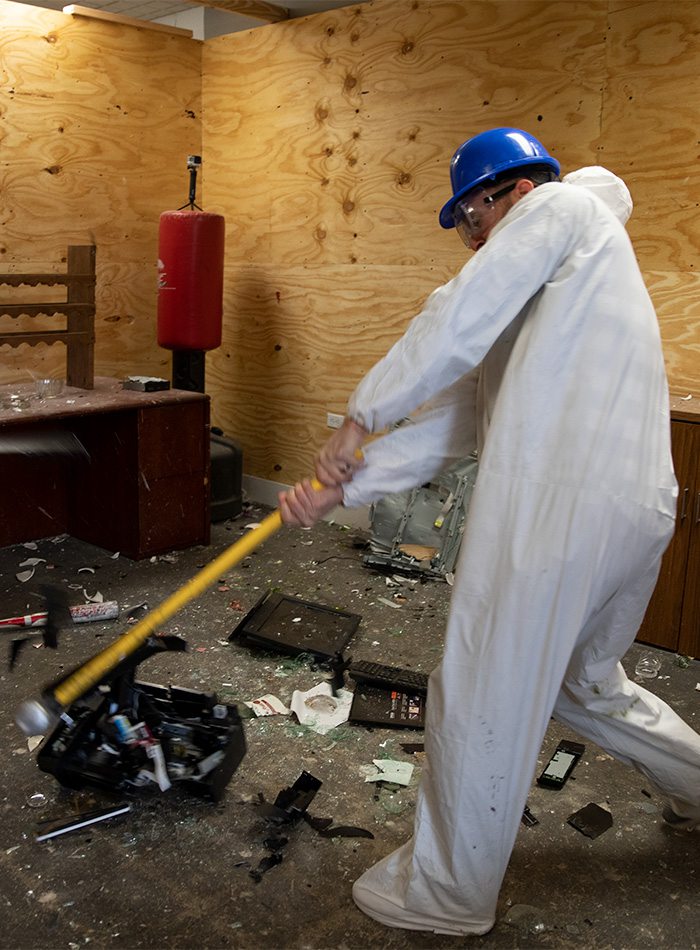 smashing a printer at the rage room