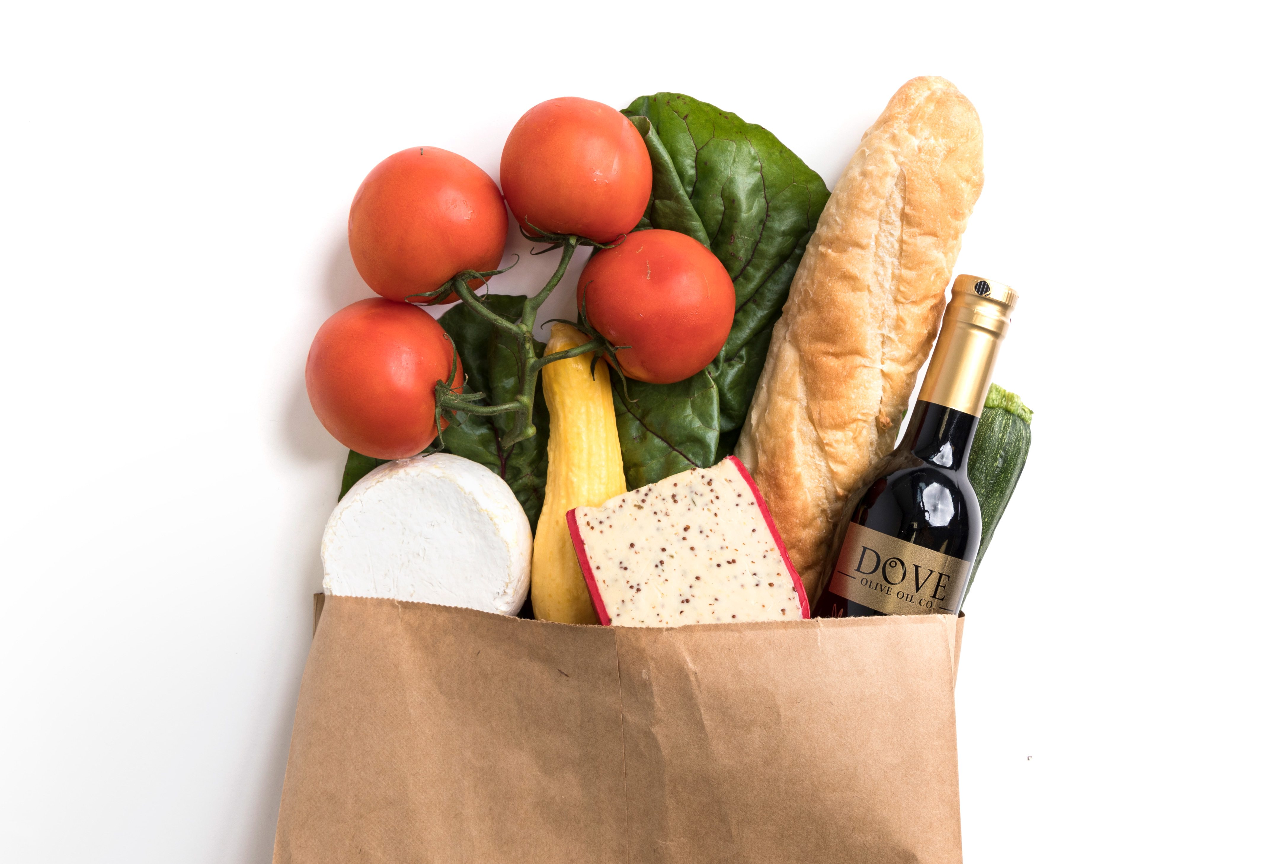 Paper grocery bag overflowing with produce