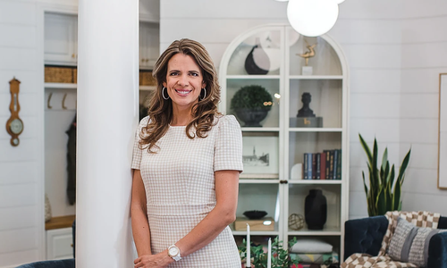 Interior designer Emily Wood in a styled living room.