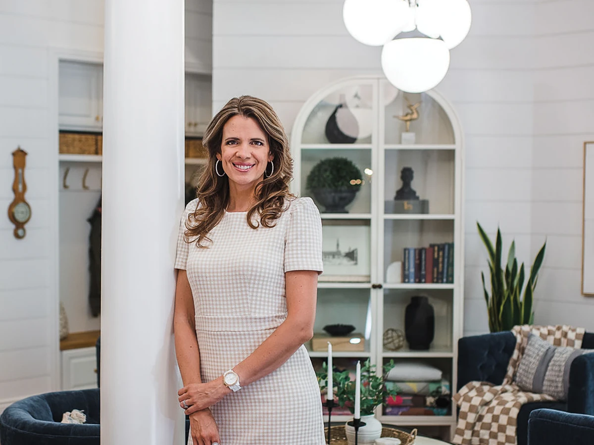 Interior designer Emily Wood in a styled living room.