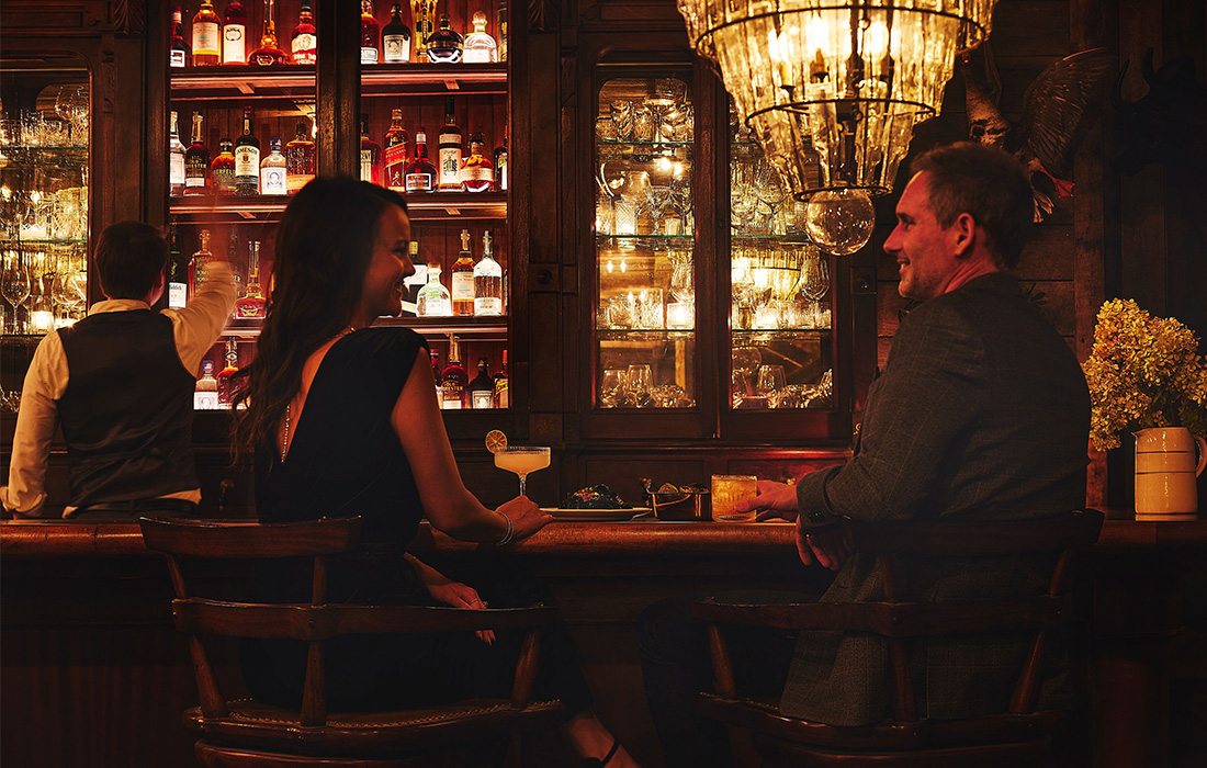 A couple enjoying food and drink at The Garrison.