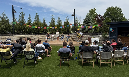 Attendees seated for the outdoor Grooms Office Environments spelling bee