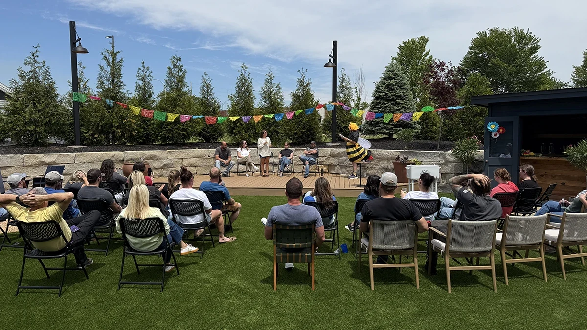 Attendees seated for the outdoor Grooms Office Environments spelling bee