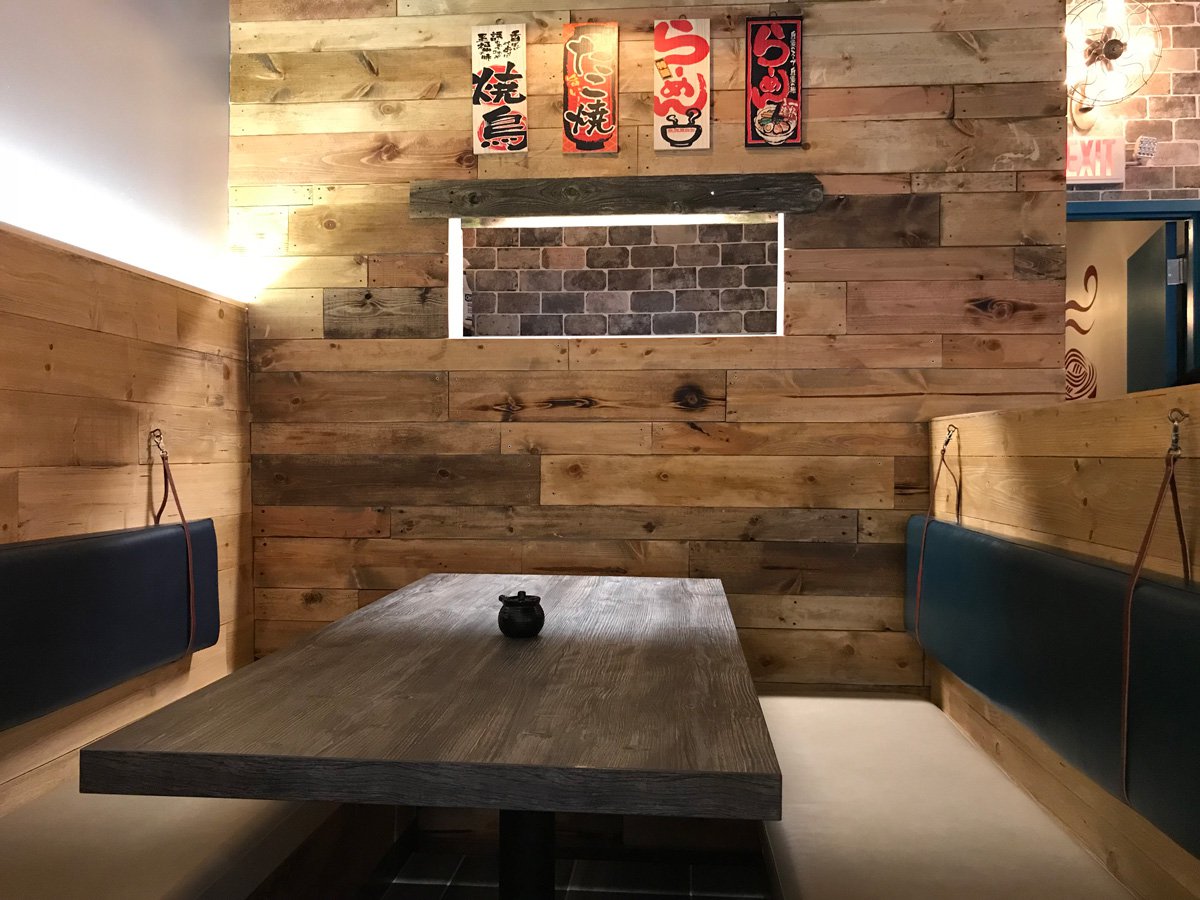 Restaurant booth with wood table