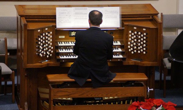 man playing organ