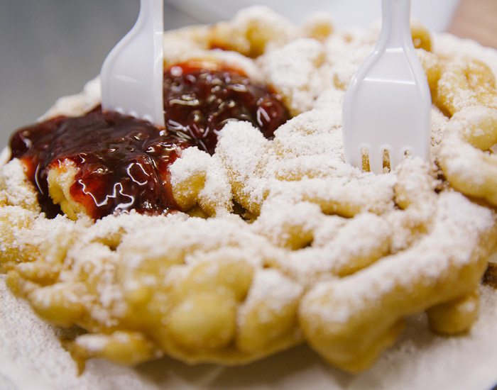 Funnel cake with forks and jelly