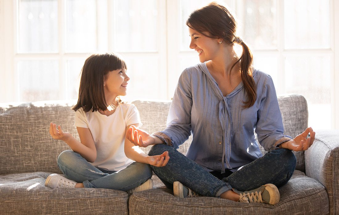 Girl and mother meditating