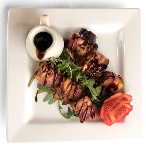 Goat cheese stuffed apricots wrapped in bacon and drizzled with balsamic glaze at St. James Winery in Branson MO