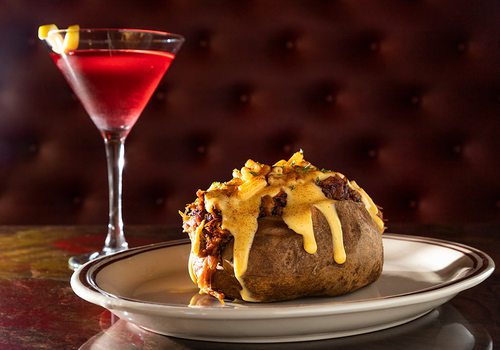 The Hot Mess baked potato topped with pulled bork and macaroni and cheese from The Collective Eatery