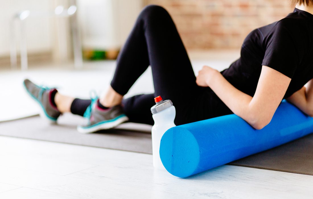 Woman foam rolling