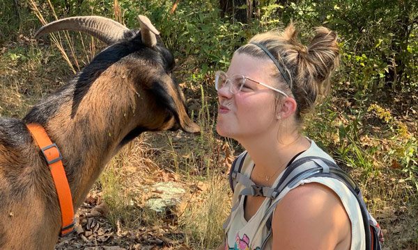 Woman with goat on 37 North Expeditions Hike
